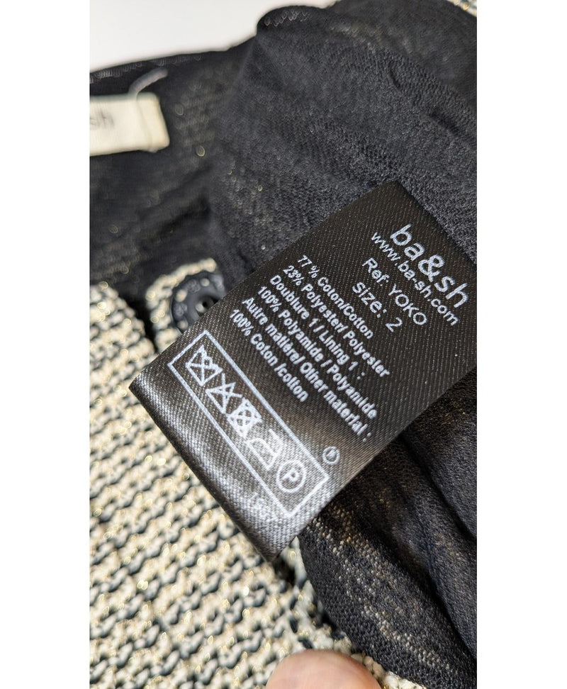 La garantie Once Again : 560021 vêtements d'occasion de marque en état irréprochable.