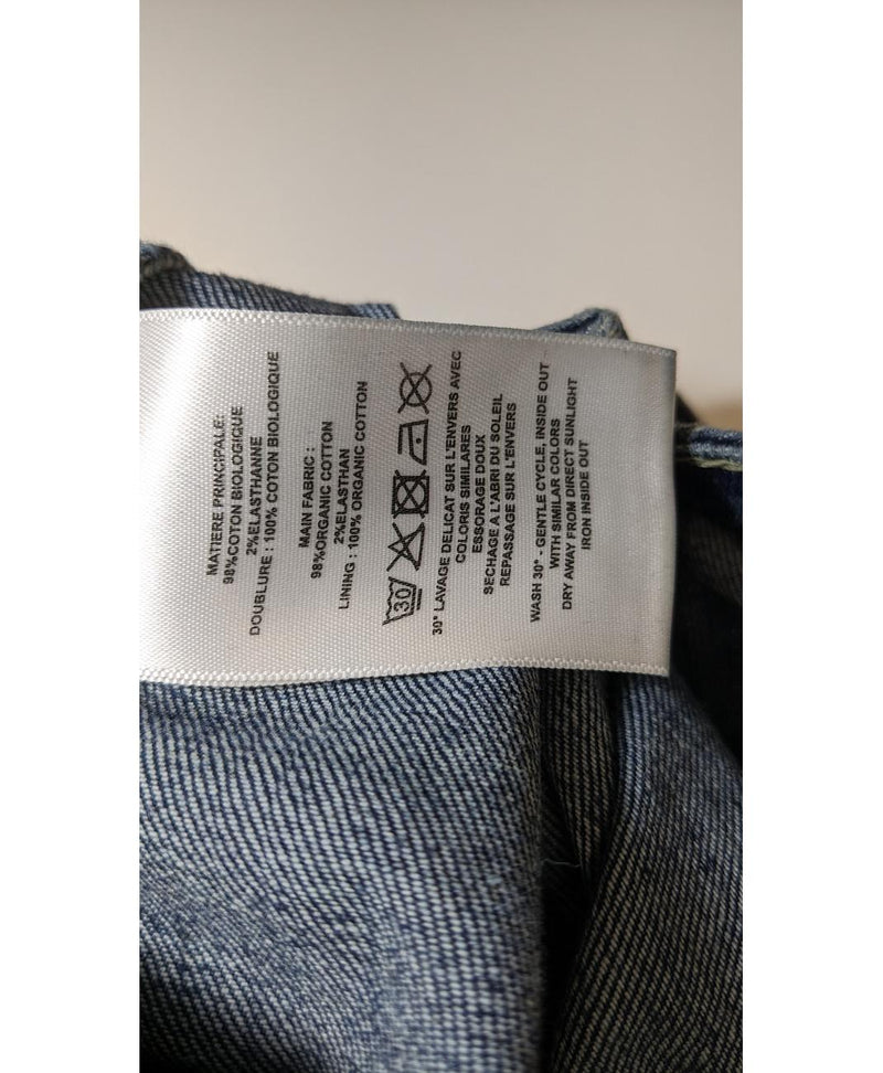 La garantie Once Again : 560574 vêtements d'occasion de marque en état irréprochable.