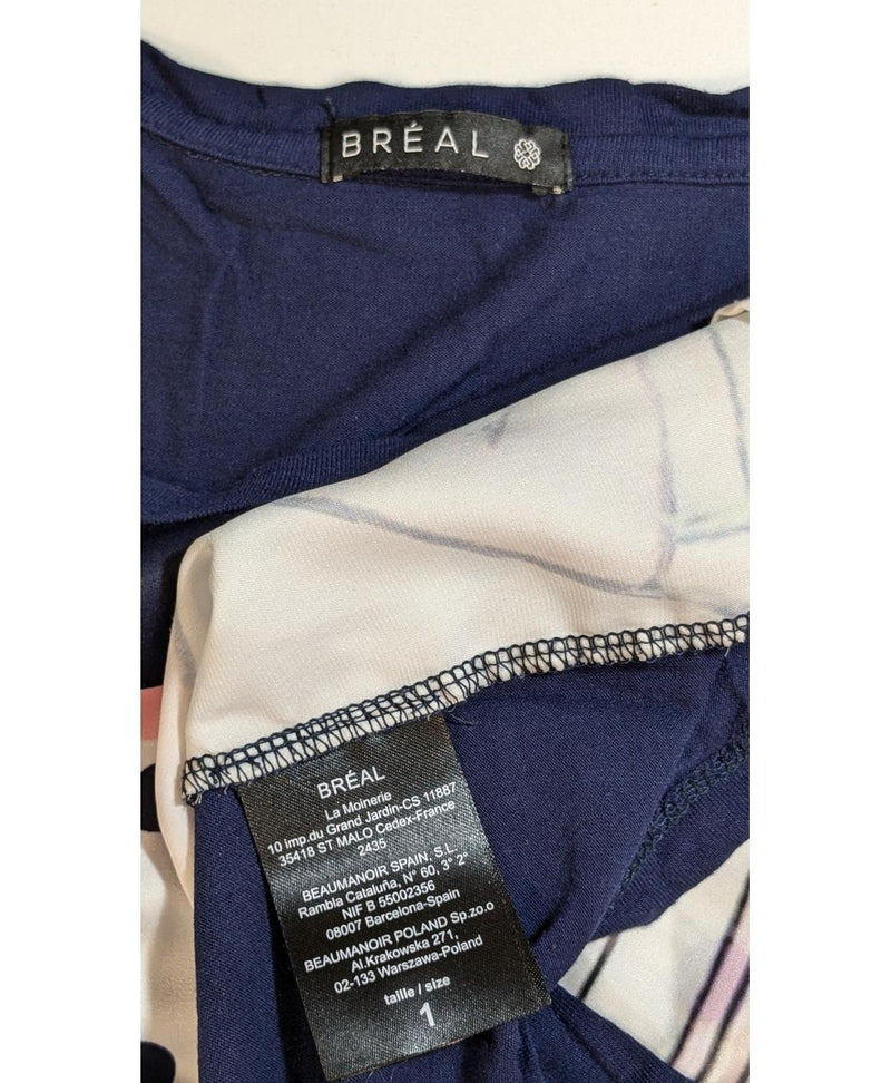 La garantie Once Again : 560761 vêtements d'occasion de marque en état irréprochable.