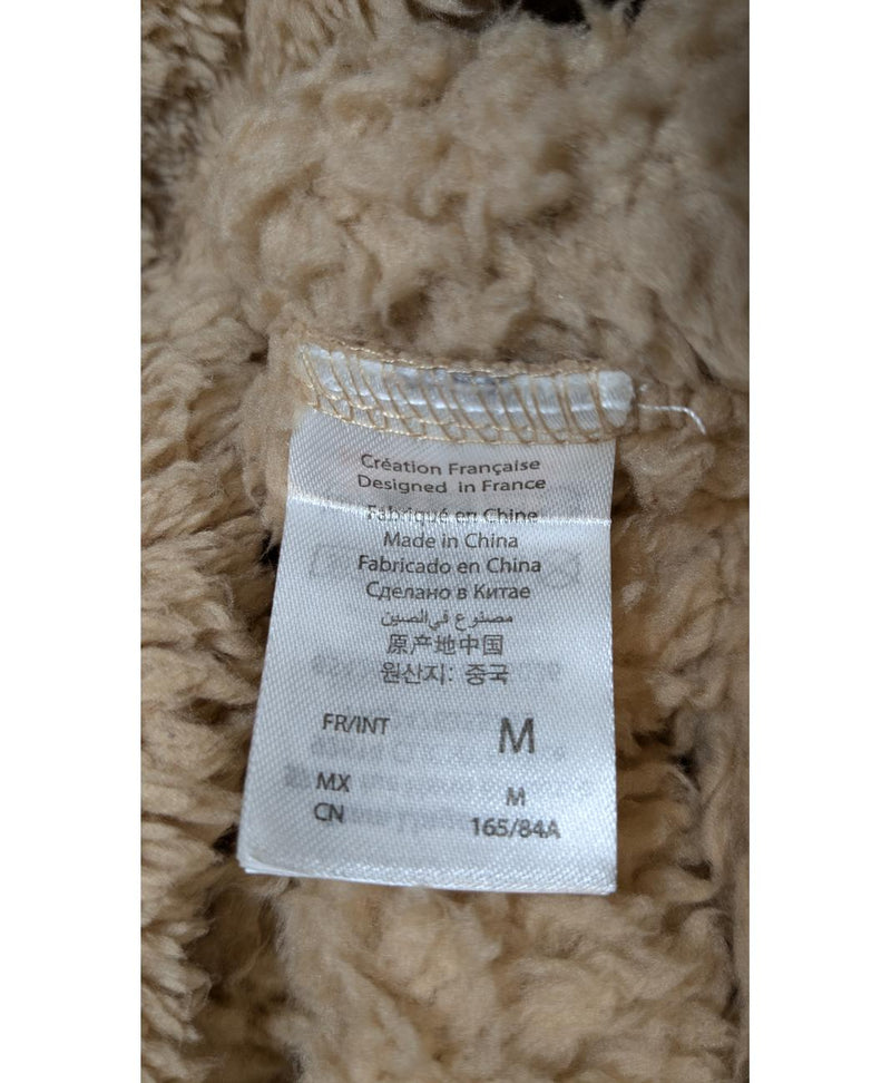 La garantie Once Again : 560849 vêtements d'occasion de marque en état irréprochable.