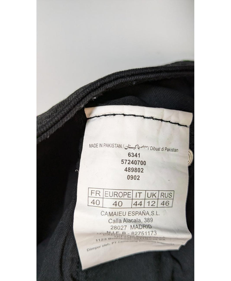 La garantie Once Again : 562009 vêtements d'occasion de marque en état irréprochable.