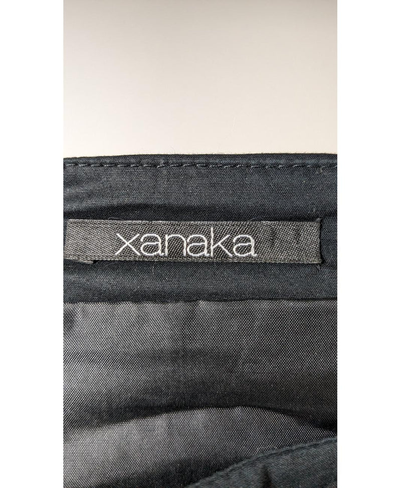 La garantie Once Again : 562546 vêtements d'occasion de marque en état irréprochable.