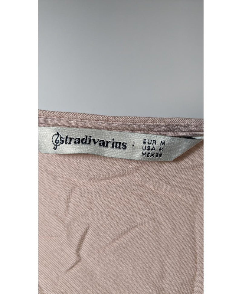 La garantie Once Again : 573732 vêtements d'occasion de marque en état irréprochable.