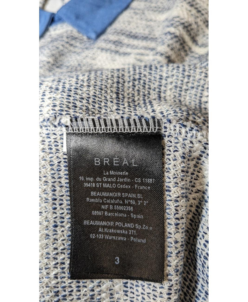 La garantie Once Again : 573819 vêtements d'occasion de marque en état irréprochable.